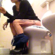 A short-haired brunette girl with dyed highlights sits down on a toilet, pisses a little and then shits with several audible, but subtle plops. She continues to smoke and relax before wiping her ass. About 3.5 minutes.